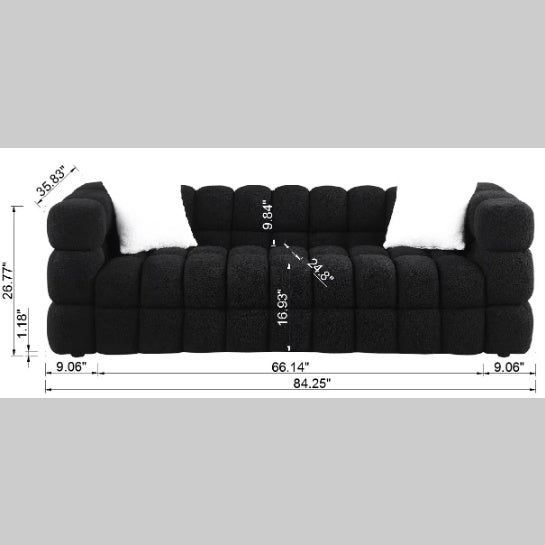 Shopi Vella modern fabric sofa for living room in black with plush cushioned design and white pillows