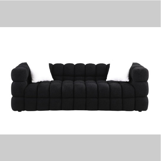 Shopi Vella modern fabric sofa for living room in black with cushioned design and white pillows