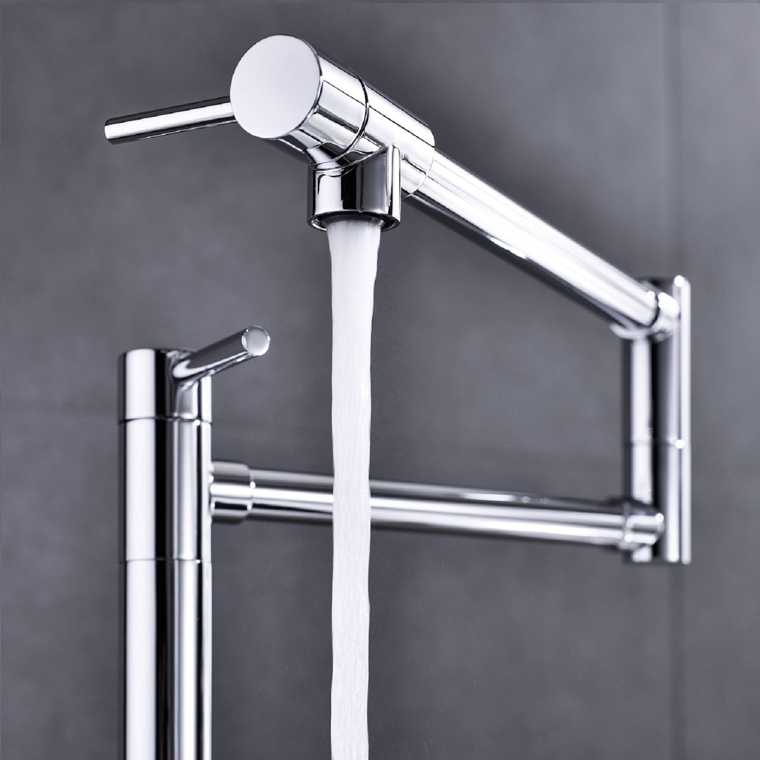 Shopi Vella modern folding sink faucet in chrome finish with water flowing in a bathroom setting