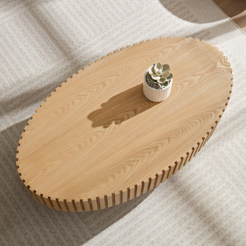 Shopi Vella modern handmade drum coffee table in light wood with an oval top and decorative edges