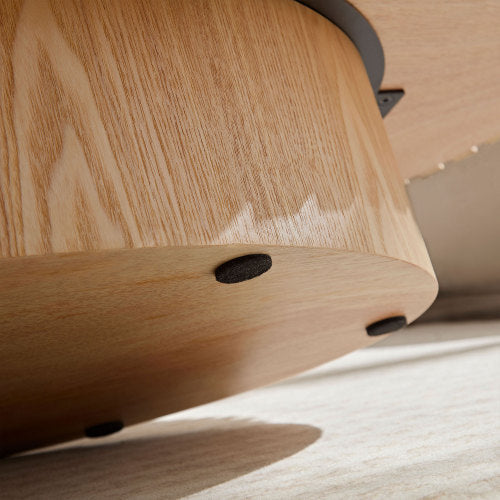 Close-up view of Shopi Vella modern handmade drum coffee table made of light natural wood