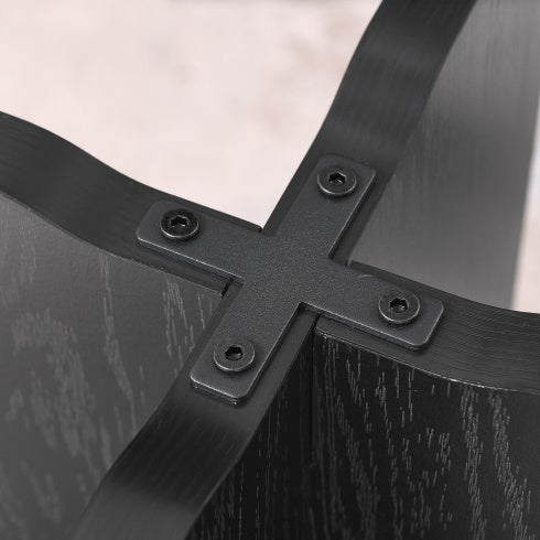 Close-up of black metal connector joining wood panels of modern solid wood coffee table by Shopi Vella