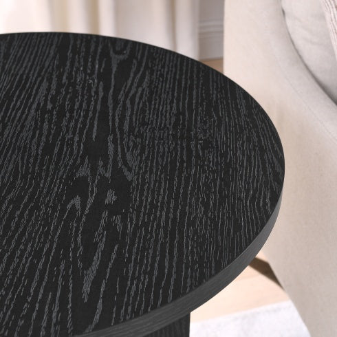 Close-up of Shopi Vella modern solid wood coffee table with black wood grain finish next to beige sofa