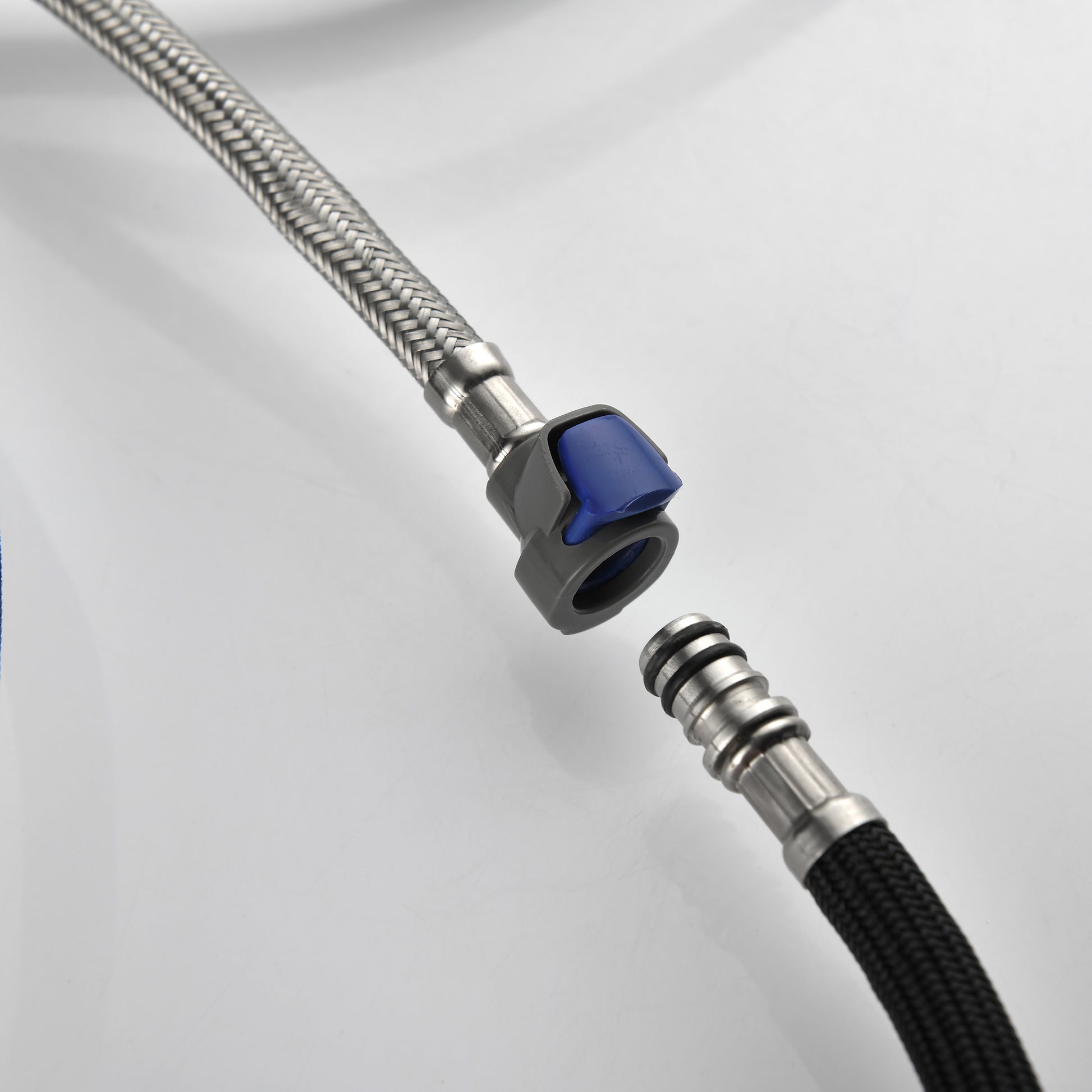 Close-up of durable braided hose connectors for modern stainless steel kitchen faucet installation