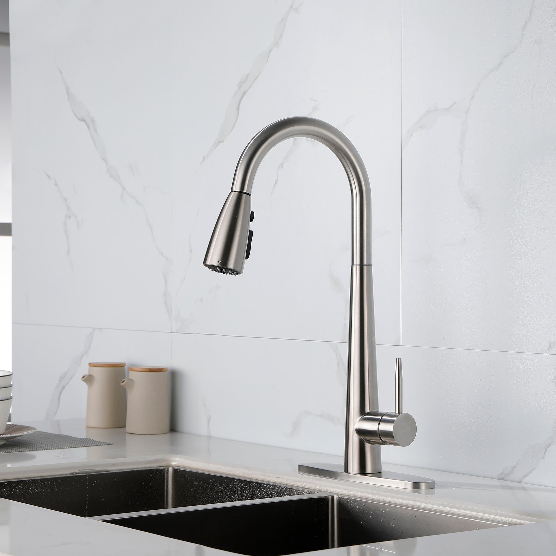 Shopi Vella modern stainless steel kitchen faucet with pull-down spray head in a modern kitchen sink