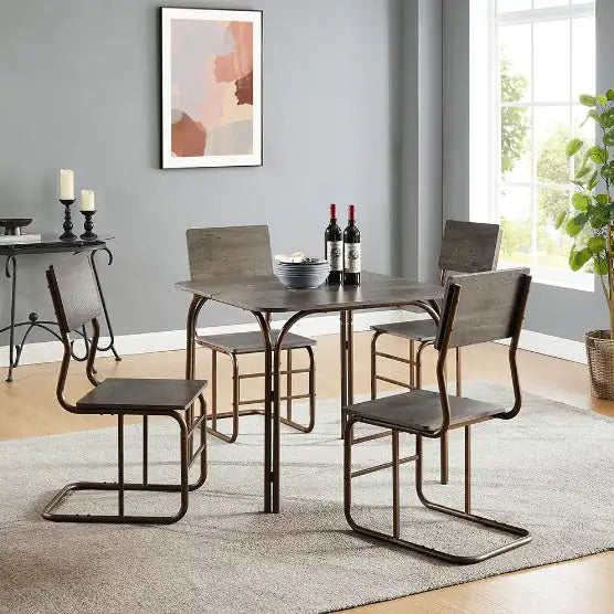 Modern wooden dining table set with metal frame and four matching chairs in a bright room