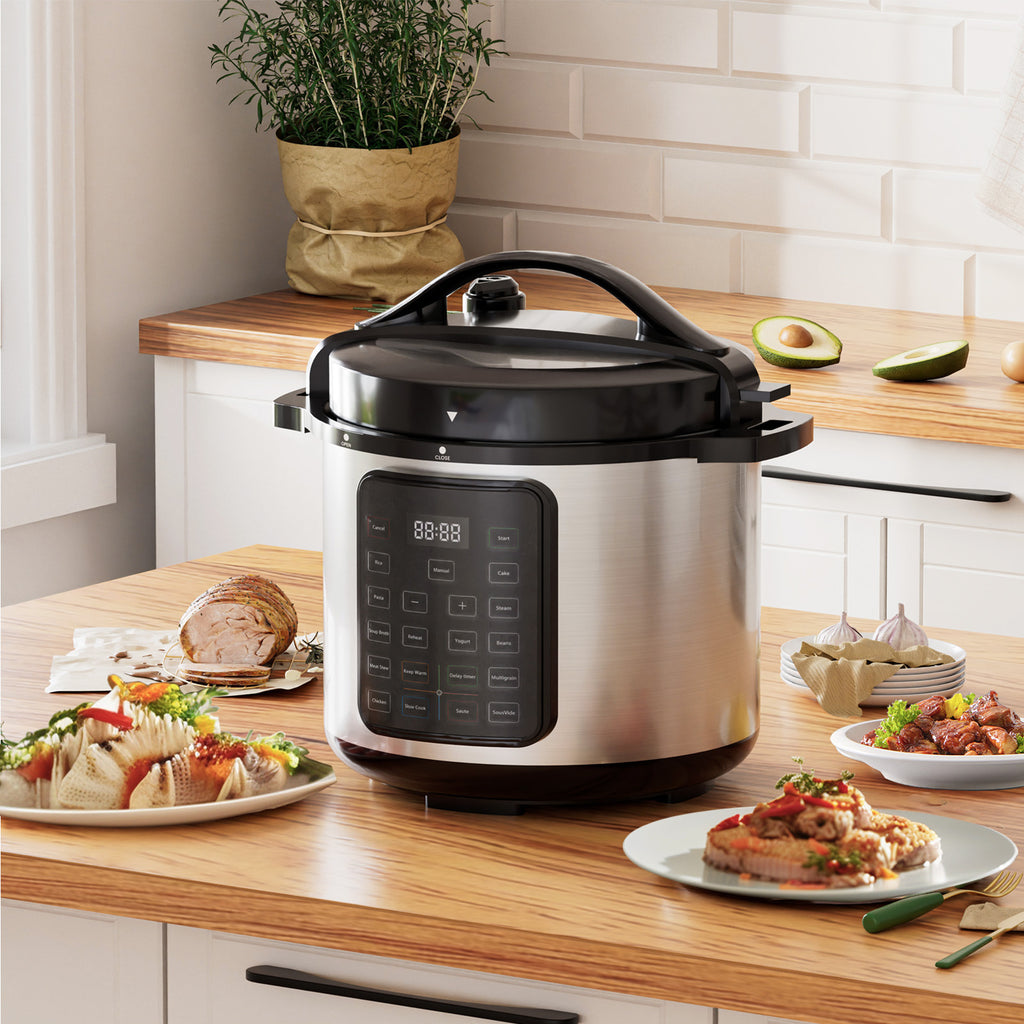 Shopi Vella multi function electric pressure cooker in stainless steel on kitchen countertop with prepared meals