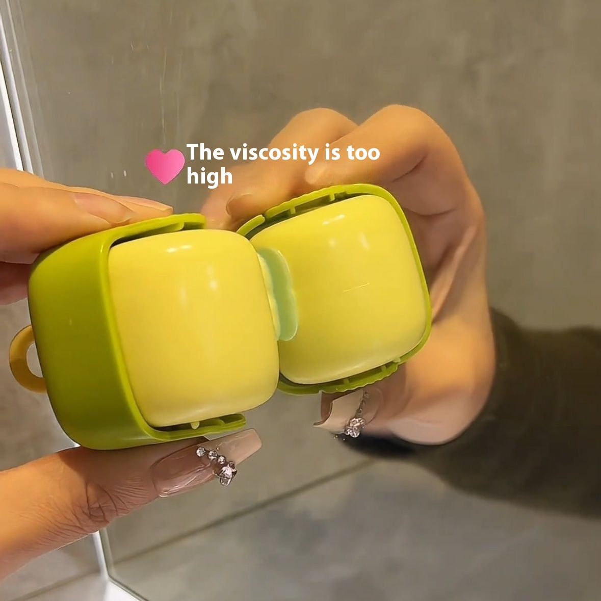 Shopi Vella multi-functional cleaning roller in lime green held in hand for kitchen storage cleaning
