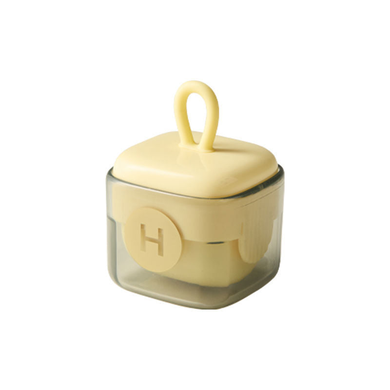 Shopi Vella multi-functional cleaning roller in compact transparent yellow container for kitchen storage