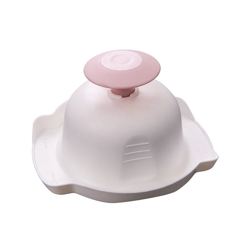 Shopi Vella multi-purpose grater and peeler with white base and pink handle for versatile kitchen use
