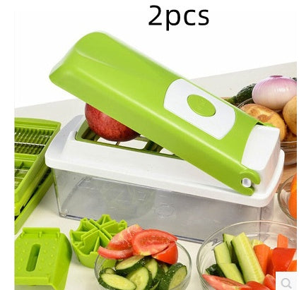 Shopi Vella multifunctional vegetable chopper with green lid and clear container slicing cucumbers and tomatoes