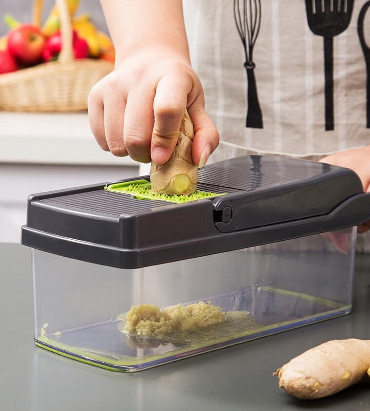 Shopi Vella multifunctional vegetable cutter for kitchen slicing ginger over clear storage container