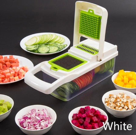 Shopi Vella white multifunctional vegetable cutter for kitchen with green blades and container filled with sliced vegetables