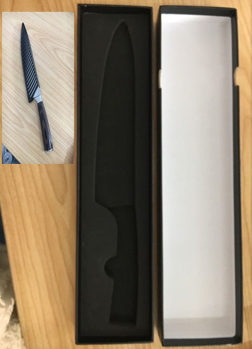 Shopi Vella multipurpose chef slicing knife with striped blade in protective black box on wooden surface