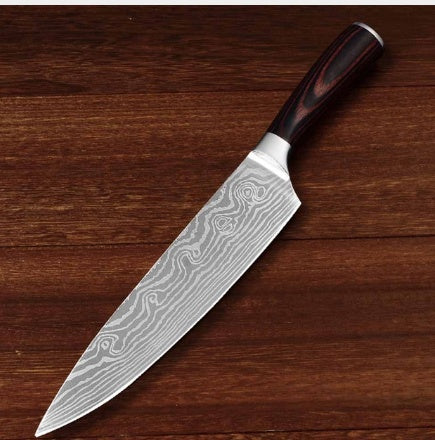 Shopi Vella multipurpose chef slicing knife with patterned blade and wooden handle on wooden surface