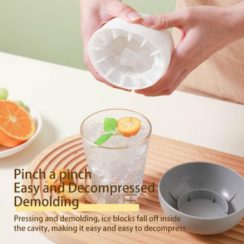 Shopi Vella mushroom ice cube mold being used to easily release ice cubes into a glass with citrus garnish