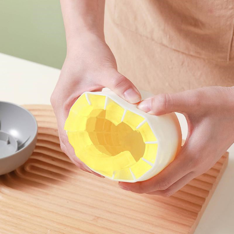 Shopi Vella mushroom ice cube mold held by hands showing yellow flexible silicone interior for easy ice removal