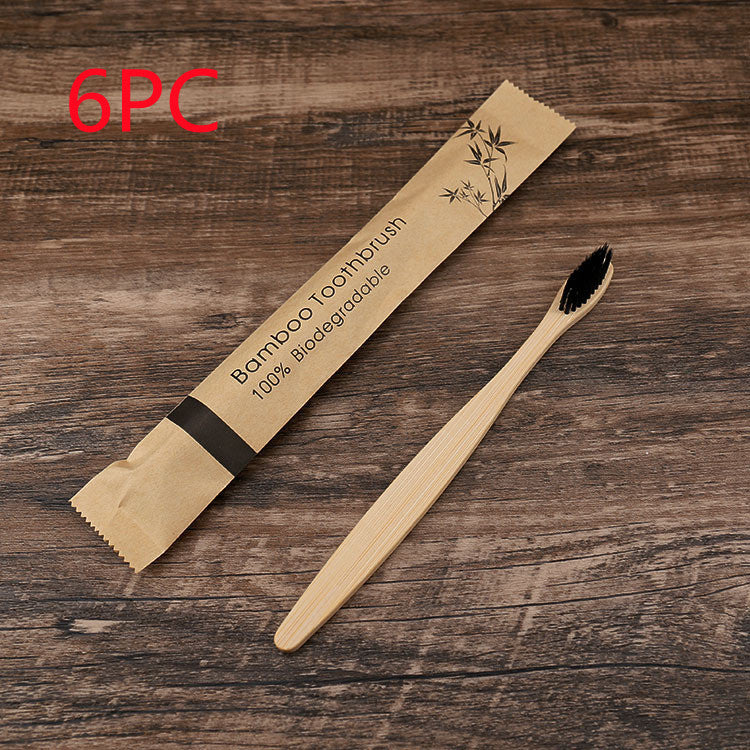 Shopi Vella natural bamboo toothbrushes soft bristle with biodegradable packaging on wooden surface