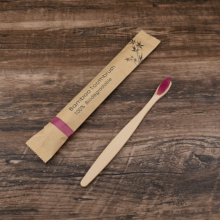 Shopi Vella natural bamboo toothbrushes soft bristle with biodegradable packaging on wood surface