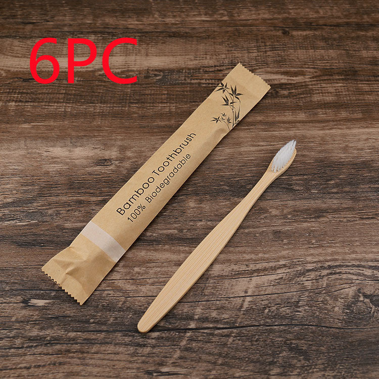 Natural bamboo toothbrushes soft bristle set of six in biodegradable packaging on wooden surface