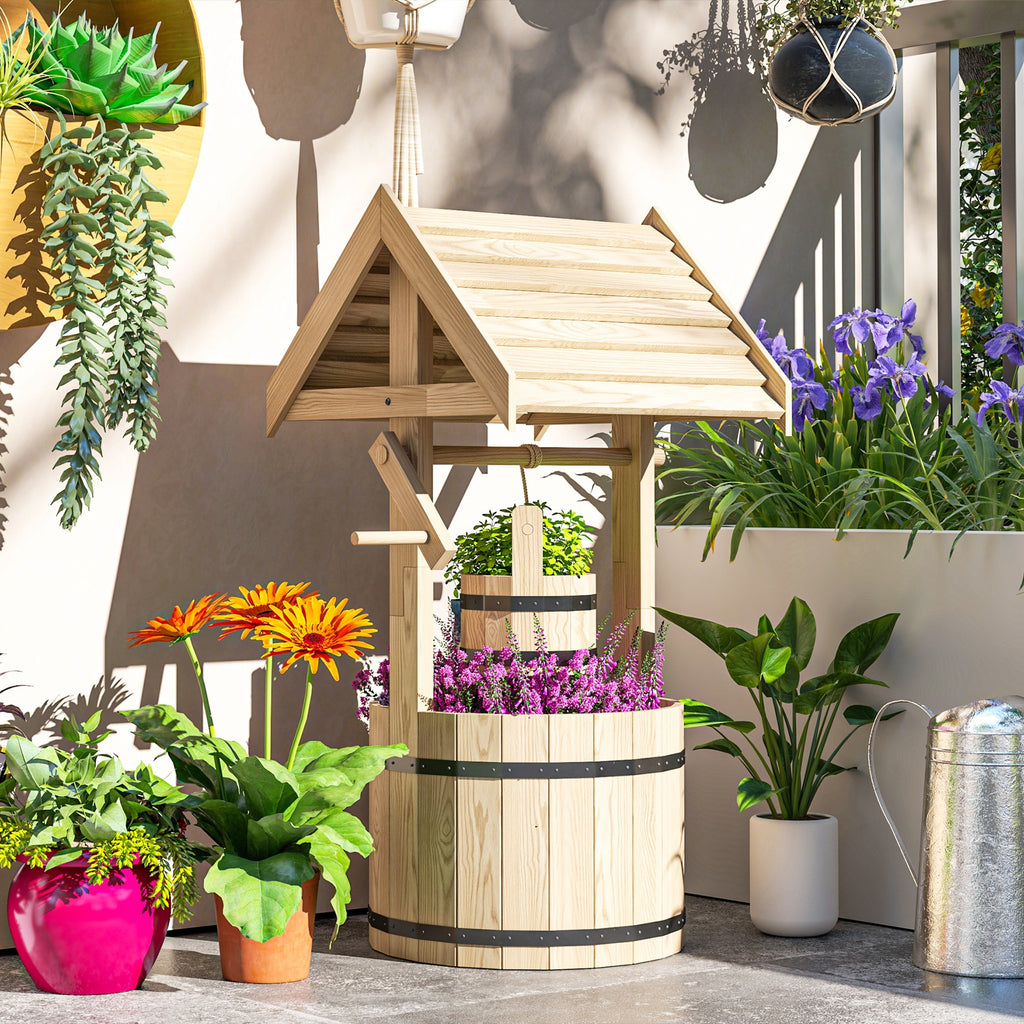 Shopi Vella natural wood garden planter with drain hole designed like a decorative wishing well filled with flowers