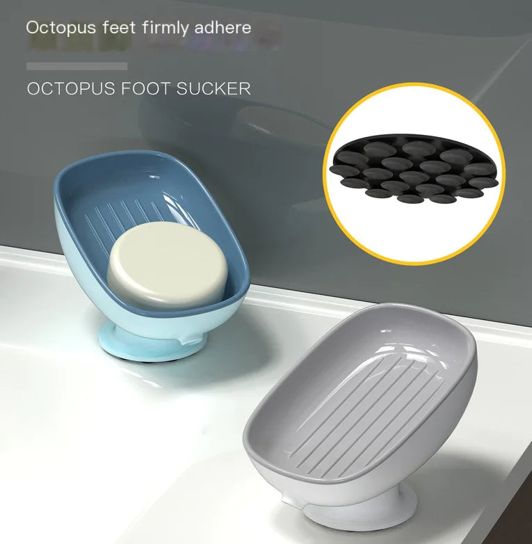 Octopus suction cup soap dish in blue and gray with strong suction cup feet holding soap on bathroom sink