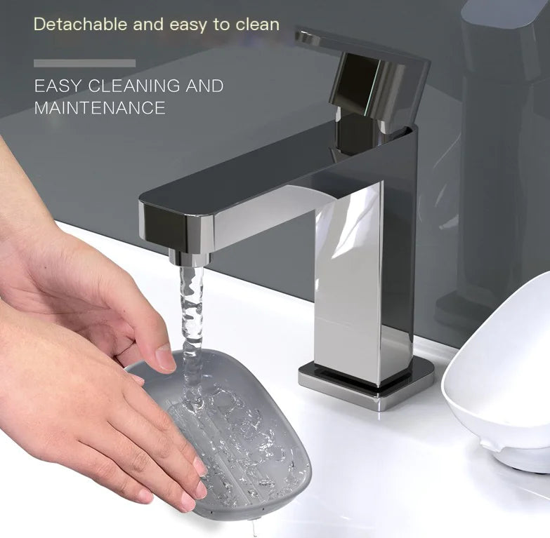 Person rinsing octopus suction cup soap dish under modern faucet showing easy cleaning and maintenance