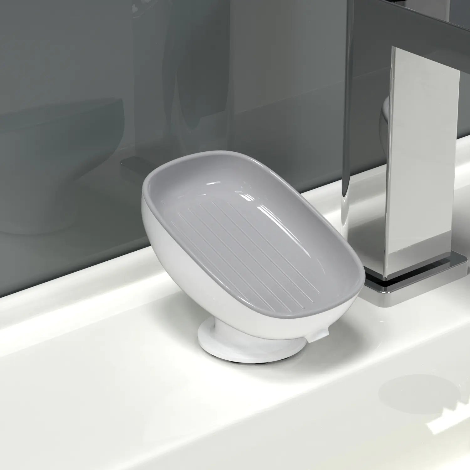 White octopus suction cup soap dish attached to bathroom sink next to modern faucet