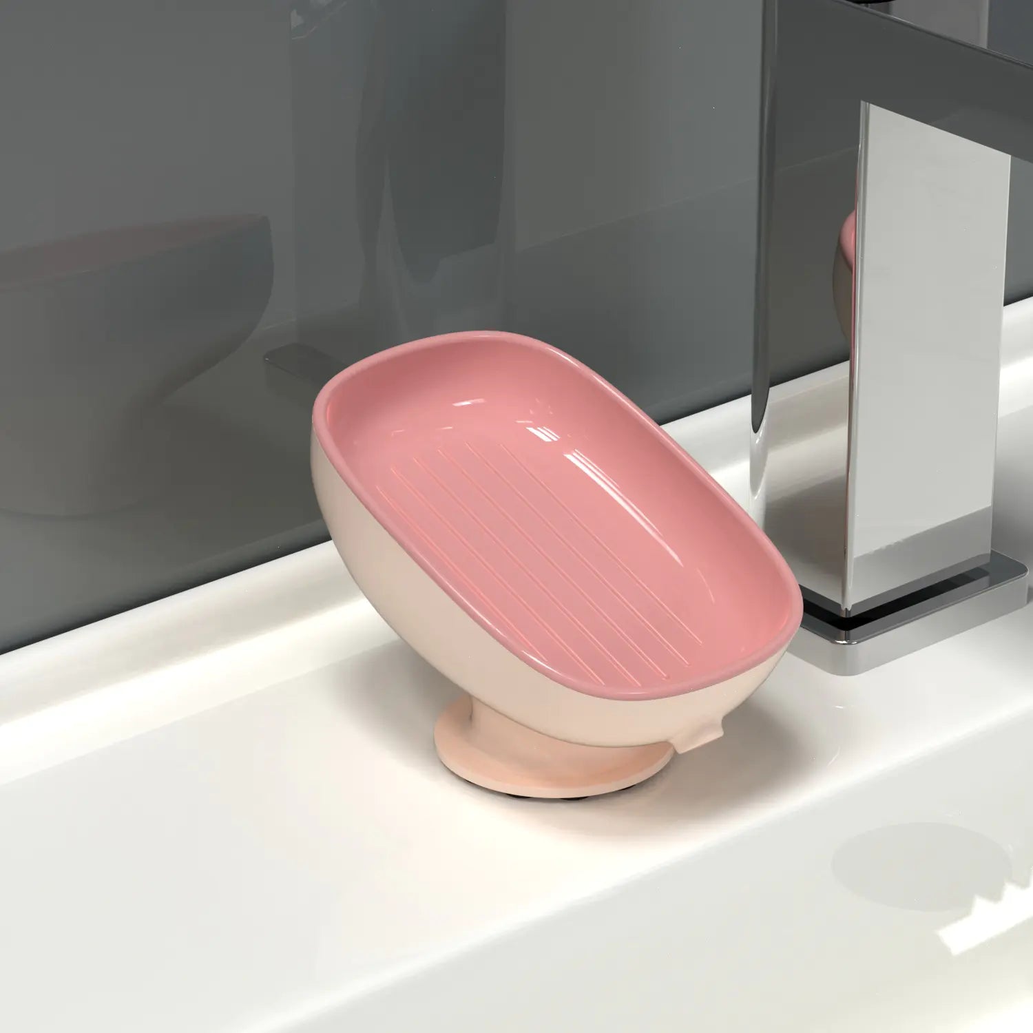 Pink octopus suction cup soap dish attached to white bathroom sink near silver faucet