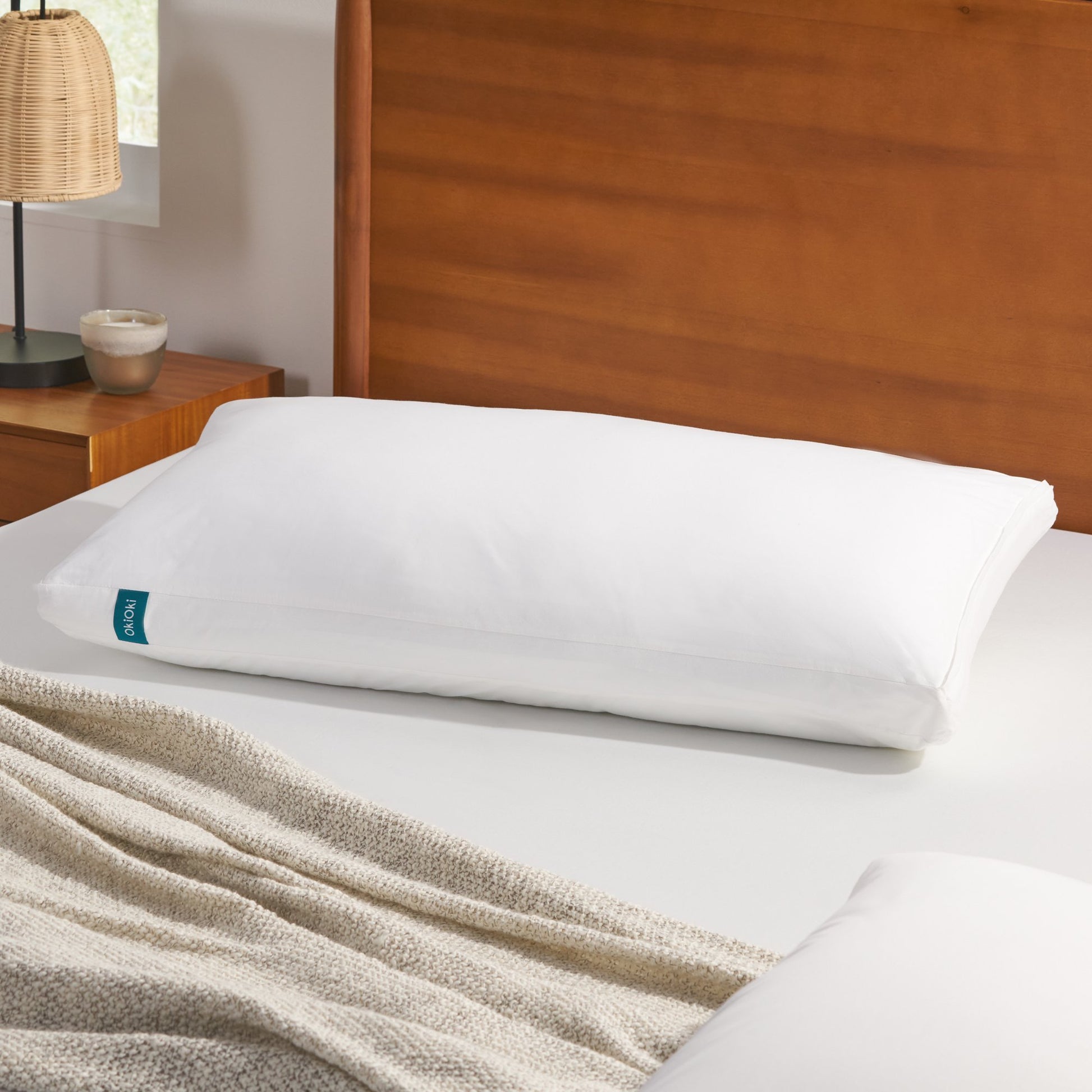 Shopi Vella white pillow case on soft supportive sleep pillow on bed with wooden headboard
