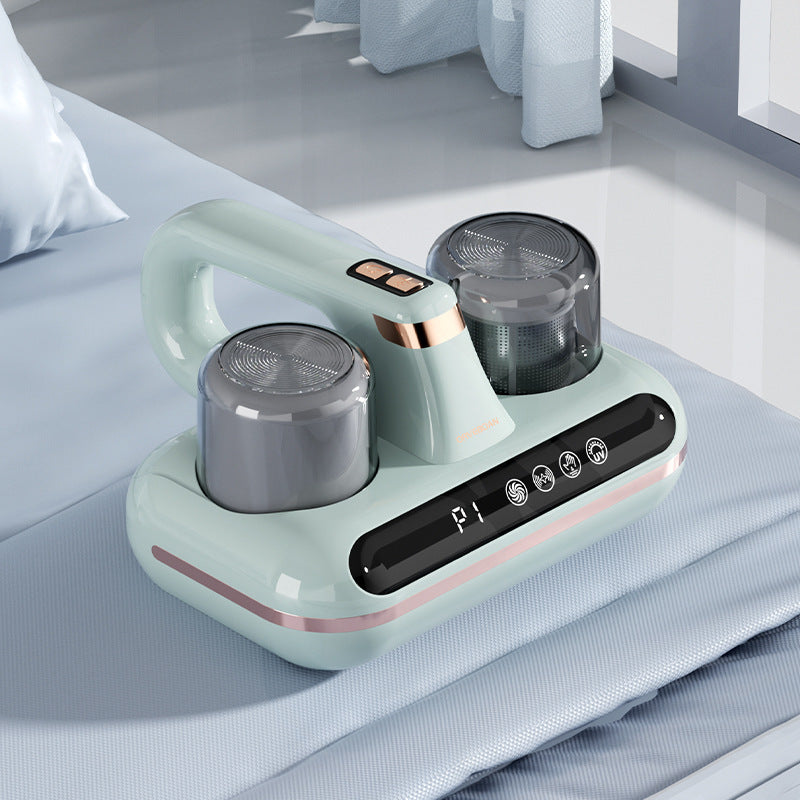 Shopi Vella cordless mattress vacuum cleaner in light green with dual dust containers on bed