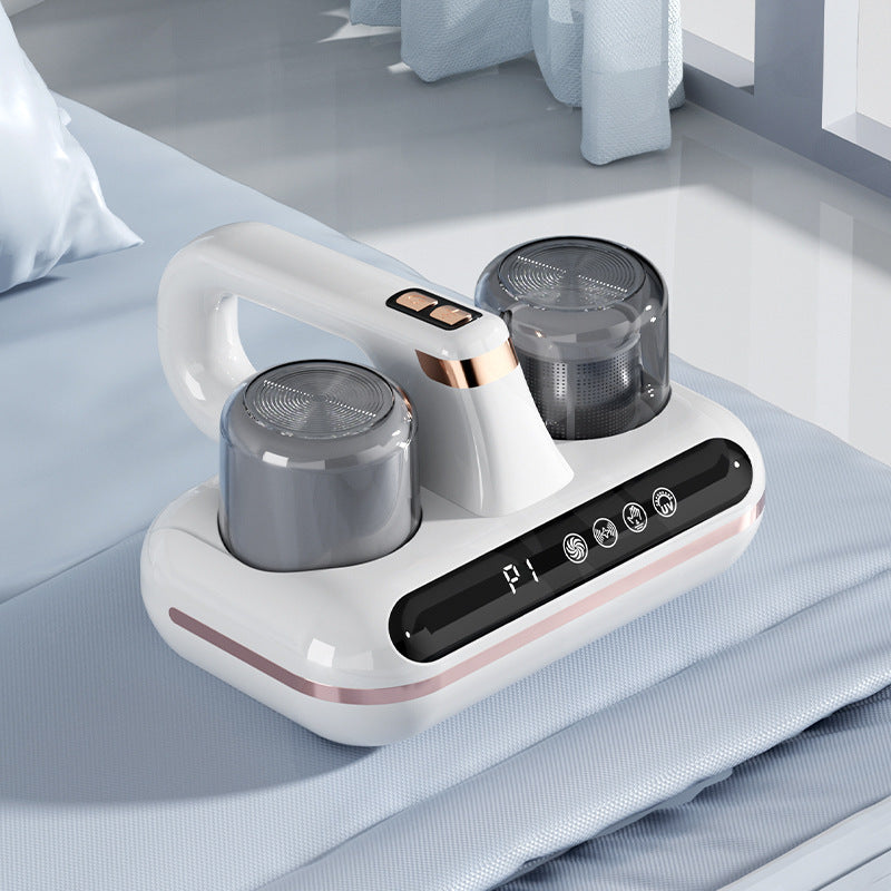 Shopi Vella cordless mattress vacuum cleaner in white with dual dust containers on a light blue bed