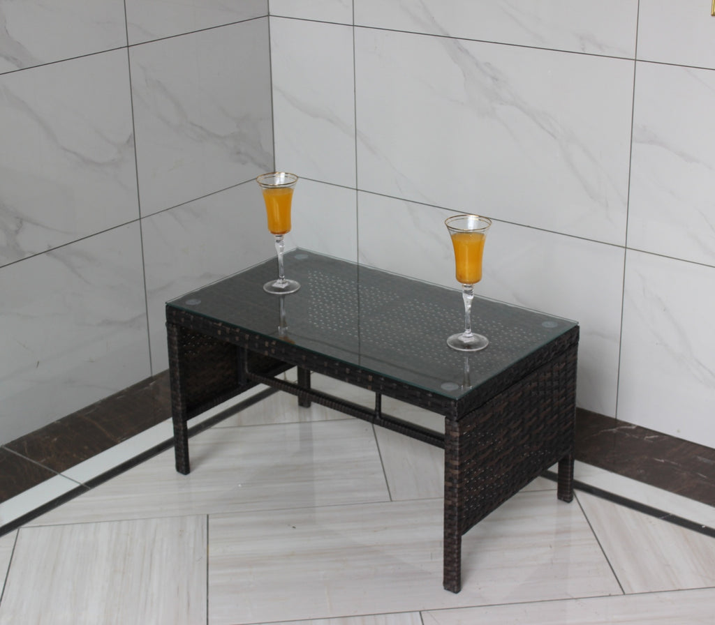 Shopi Vella outdoor patio coffee table with glass top and dark woven rattan frame