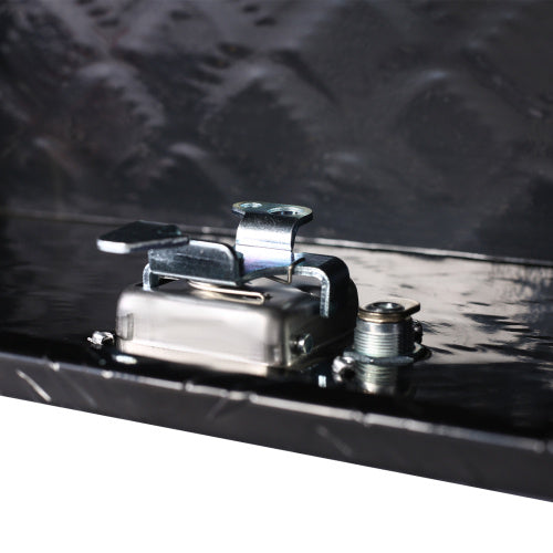 Close-up of metal latch on outdoor trailer underbody storage box by Shopi Vella