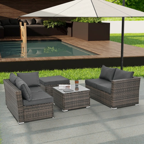 Shopi Vella outdoor wicker patio furniture set with gray cushions and glass-top coffee table by pool