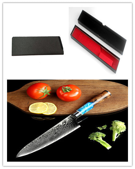 Shopi Vella pattern kitchen knife with decorative blade and wooden handle displayed with vegetables and protective case