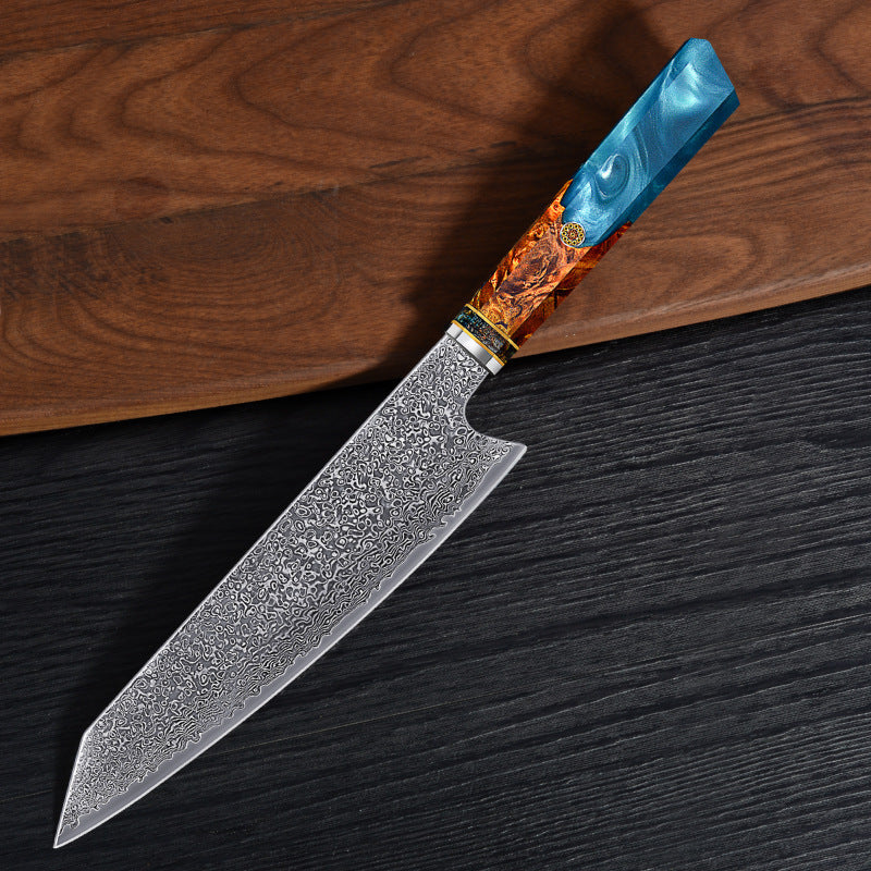 Shopi Vella pattern kitchen knife with detailed blade and blue and brown handle on wooden surface