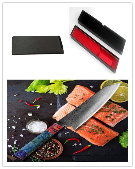 Pattern kitchen knife with colorful handle next to salmon fillets and herbs with protective black and red storage box