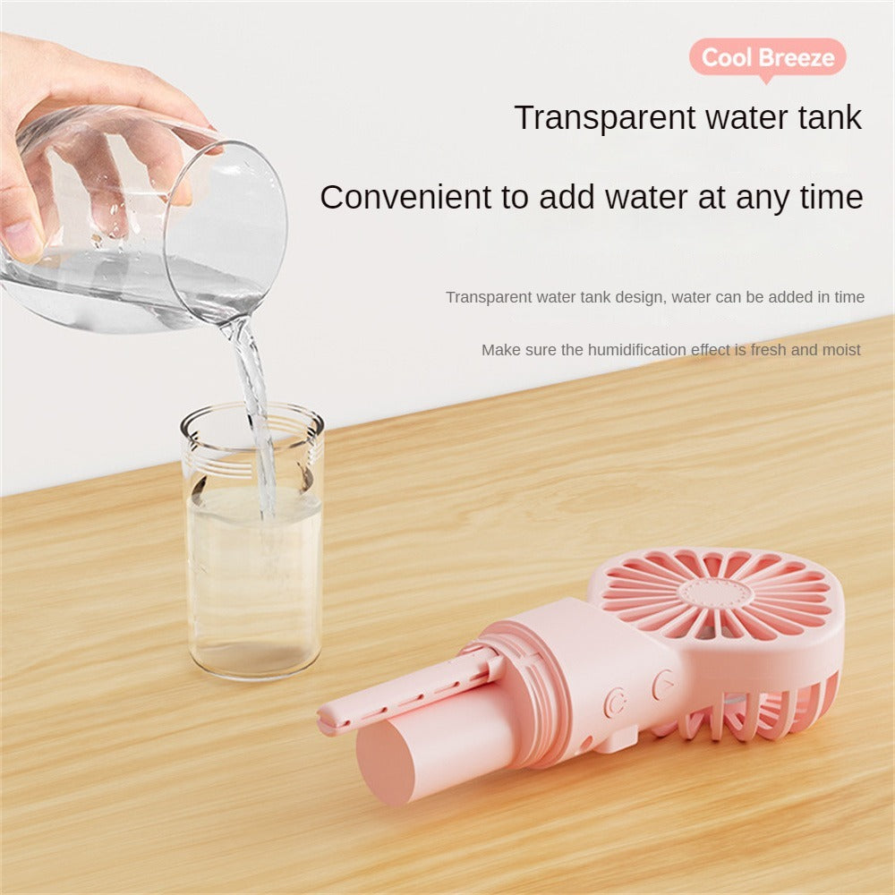 Shopi Vella personal desk fan with water mist in pink with transparent water tank on wooden desk