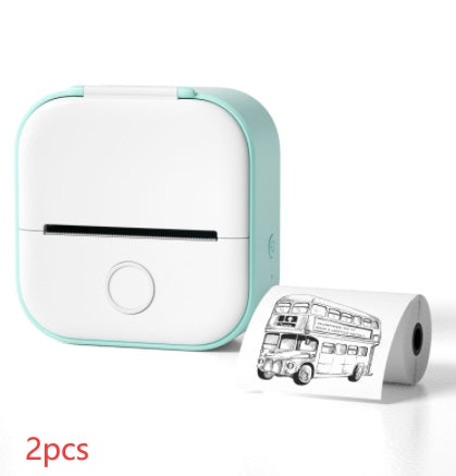 Shopi Vella portable mini thermal label printer in white and mint green with printed paper roll