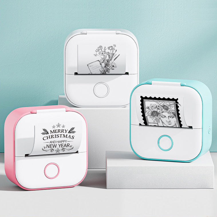 Shopi Vella portable mini thermal label printer in pink white and blue printing black and white designs