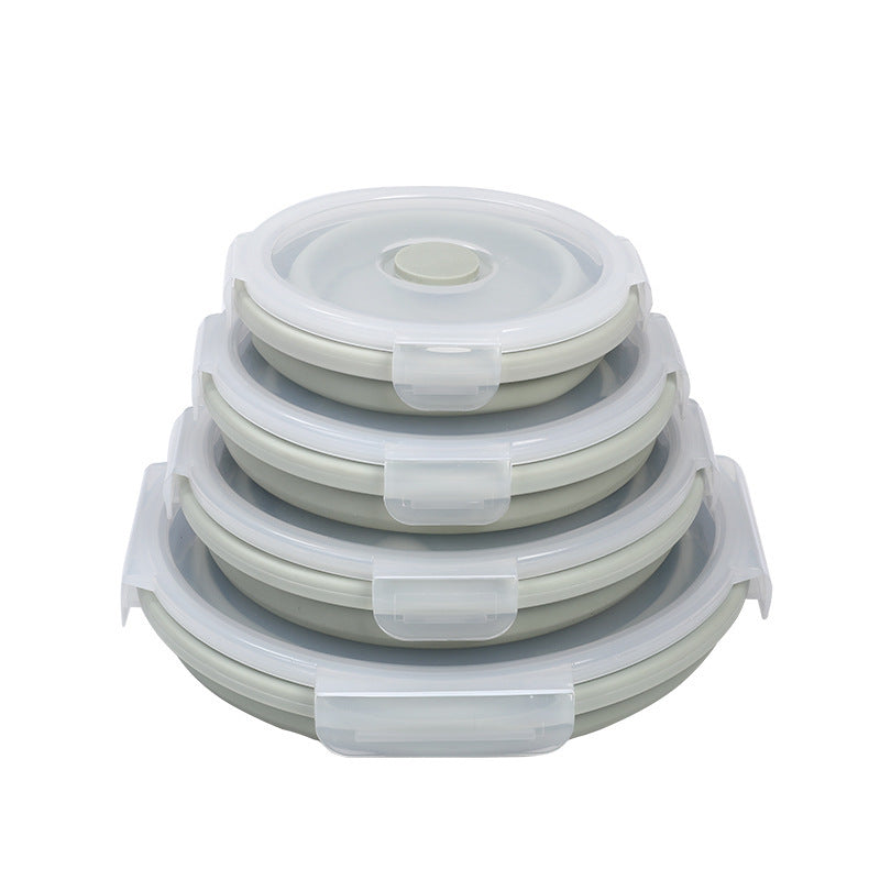 Set of four collapsible silicone lunch box containers with clear locking lids stacked together
