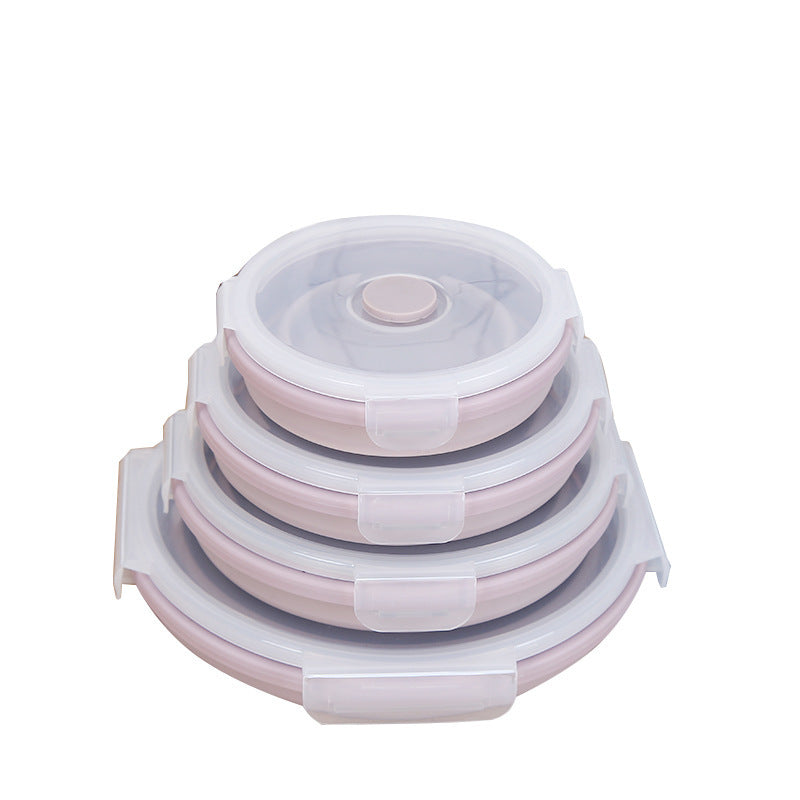 Set of four stackable pink silicone lunch box containers with clear airtight lids