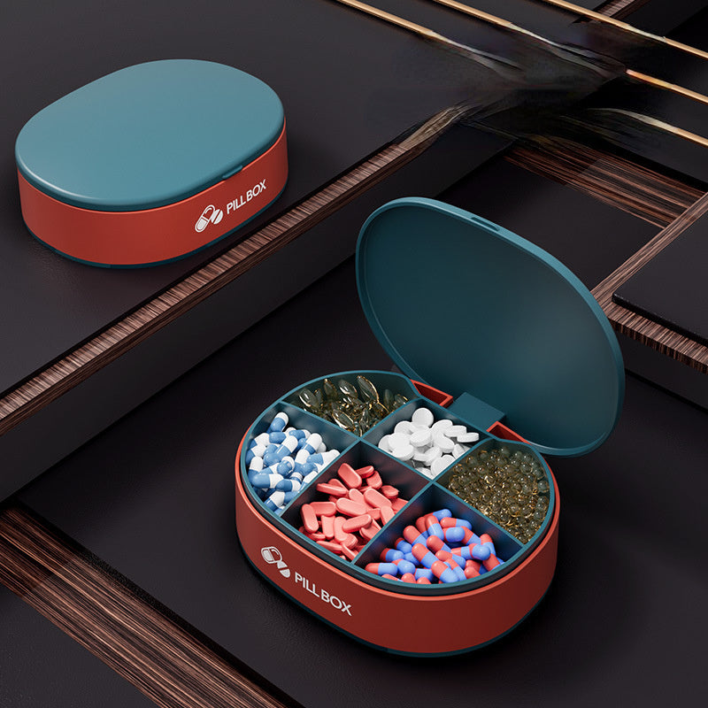 Shopi Vella portable weekly pill organizer with five compartments filled with various pills and capsules