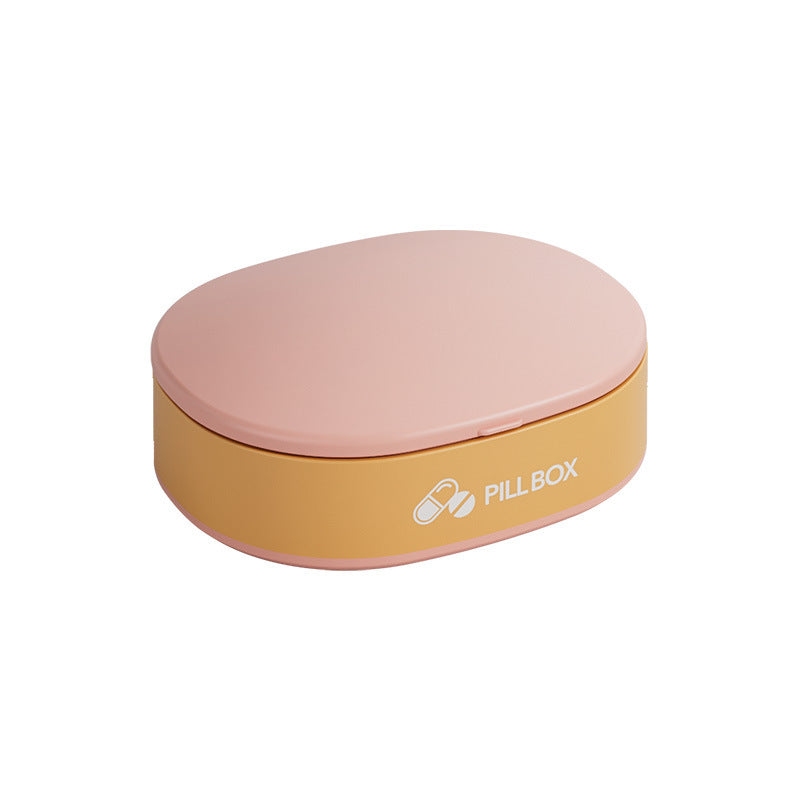 Shopi Vella portable weekly pill organizer in pink and yellow compact pill box design