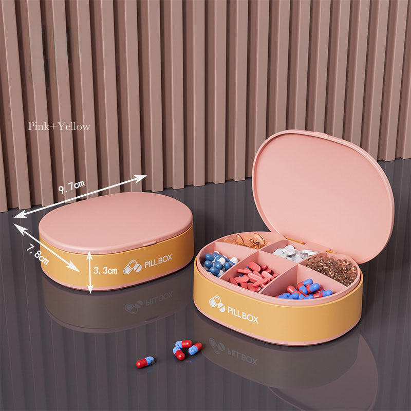 Shopi Vella portable weekly pill organizer with multiple compartments in pink and yellow color