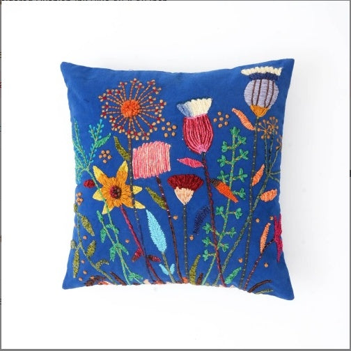 Shopi Vella blue pillow case with colorful floral embroidery featuring a pink embroidered cushion cover design