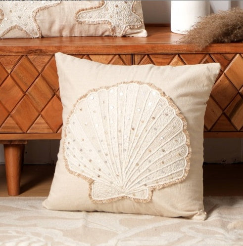 Shopi Vella beige pillow case with intricate shell design embroidery on front