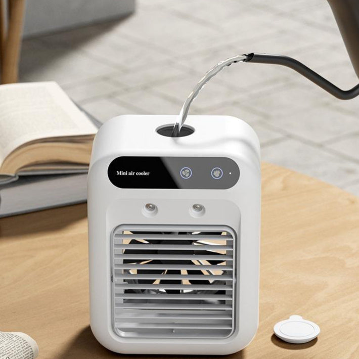 Shopi Vella portable air cooler for room in white with water filling being poured on top