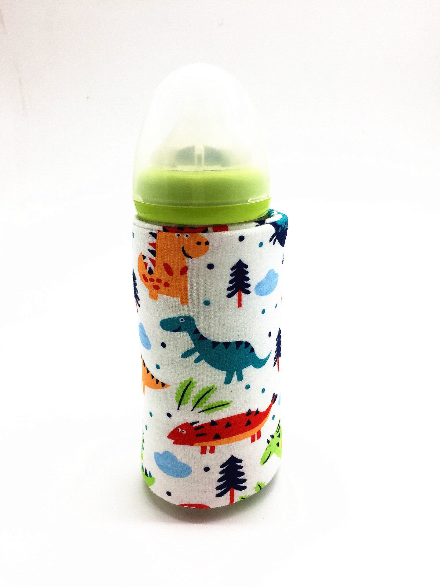 Shopi Vella portable baby bottle warmer with colorful dinosaur print on white background